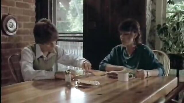Private Teacher 1983: Brunette couple at table in vintage softcore scene