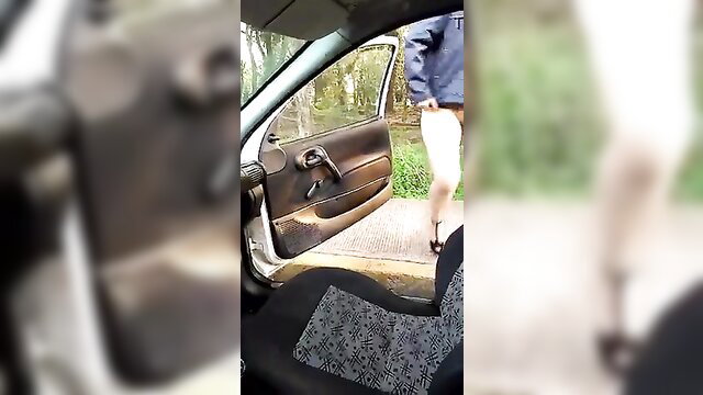 Amateur Latina pissing outdoors by car door, legs spread wide
