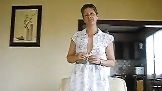 Mature white housewife in open white dress exposing cleavage