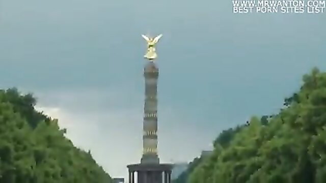 Exhibitionist couple by Siegessäule monument in Berlin park