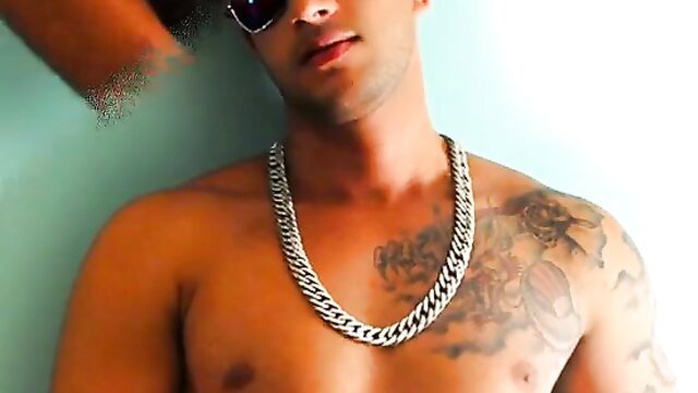 Shirtless Latino stud Diogo flexes tats and thick silver chain