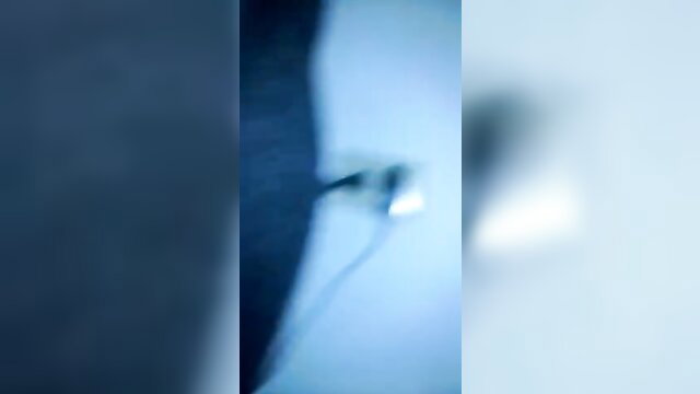 Blurry closeup of woman helping guy jerk off with handjob