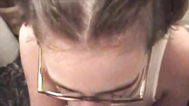 Closeup POV of woman's face engulfing cock at wild party