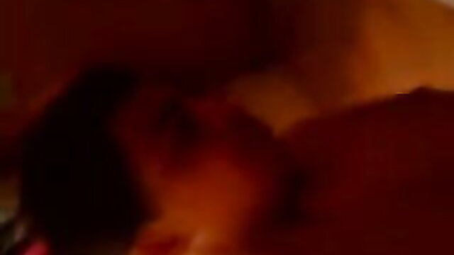 Tina Latina in steamy bedroom scene, dark hair and curves