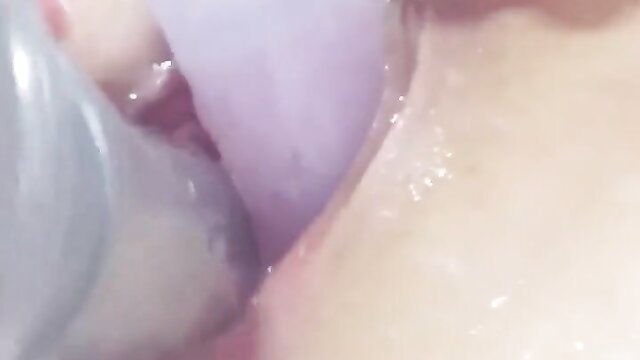 Japanese JK masturbates with two dildos in mouth and pussy closeup