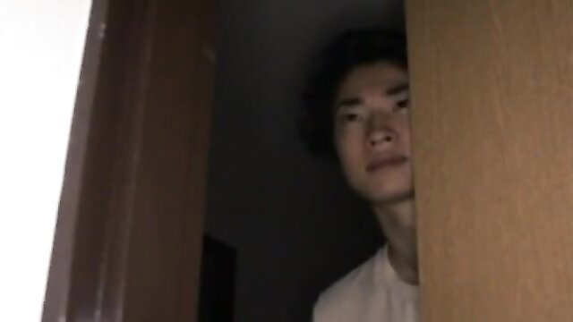 Asian stepmom peeking seductively from door in taboo home video