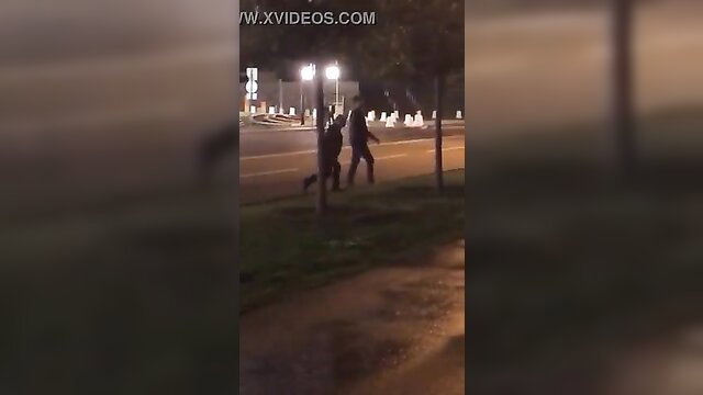 Outdoor public sex threesome with shadowy figures on dark street