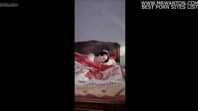 Asian slut sleeping nude in red sheets, hot tits exposed