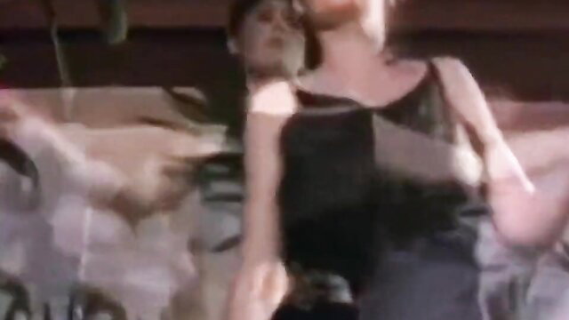 Vintage 80s big natural boobs woman in black dress striptease dance