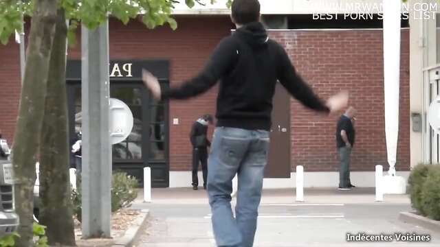 French mature MILF flirts outdoors with men in hoodies and jeans