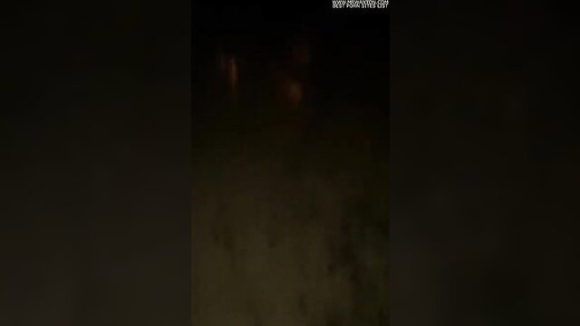 Blurry naughty woman dogging in dark parking lot at night