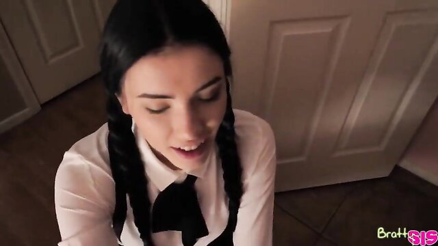Jasmine in schoolgirl uniform with pigtails, seductive expression