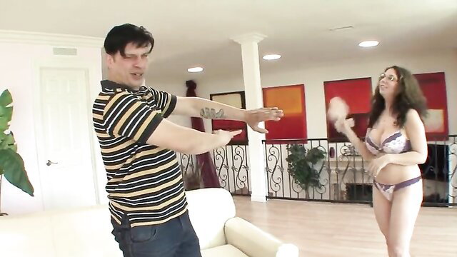 Kiki Daire in lingerie dances seductively for man in striped shirt