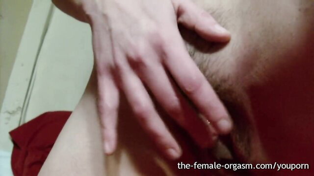 Hairy woman's hand stroking man's cock closeup, dripping wet cum