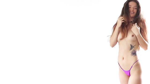 Irene Rouse topless in pink thong, tattoos, photoshoot pose