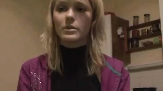 Blonde amateur babe in purple hoodie and black turtleneck, shocked expression