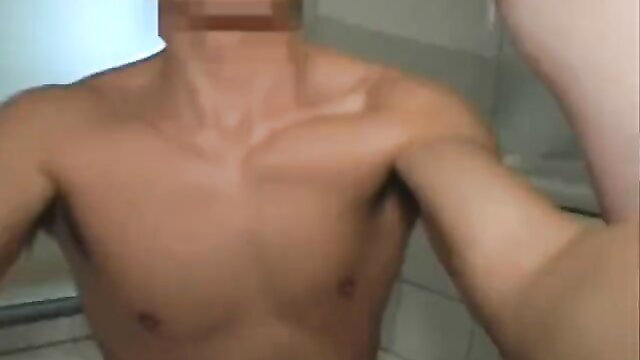Nude Korean amateur guy flexing toned muscles in bathroom selfie