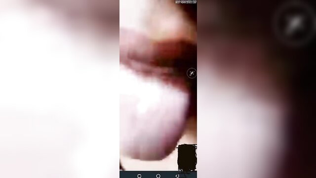 Closeup of woman's wet pink tongue and lips in explicit tease