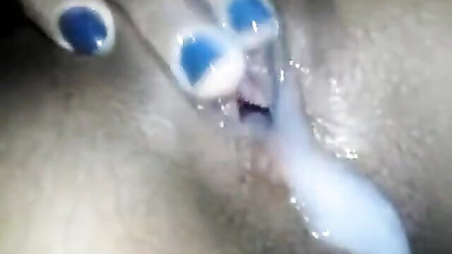 Closeup of mature woman's wet pussy with blue clamps during amateur creampie
