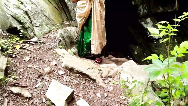 Horny Indian maid in saree at cave entrance, outdoor risky public tease
