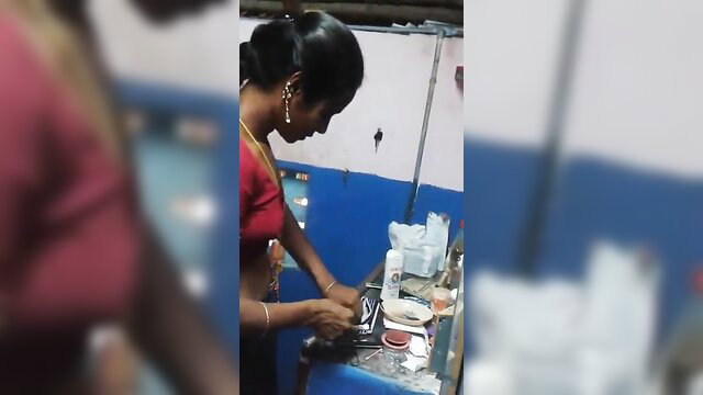 Tamil aunty in red blouse changing saree, cleavage exposed