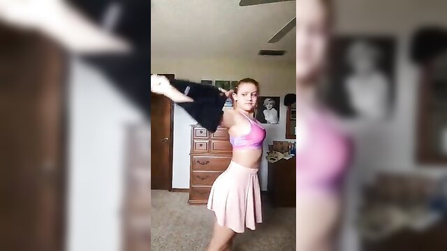 Teen in pink lingerie undressing skirt in bedroom solo tease