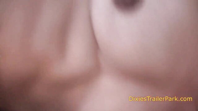 Blurry closeup of woman's pale tits and nipples in explicit thumbnail