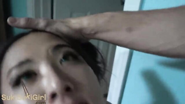 Sukisukigirl green eyes held by hand in intense throatfuck POV