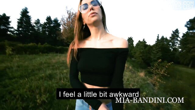 Mia Bandini feels awkward in off-shoulder top and jeans outdoors