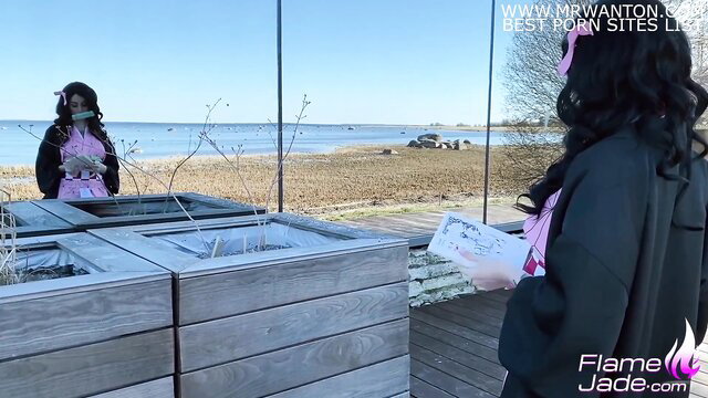 Flame Jade as Nezuko cosplay in pink kimono at beach mirror