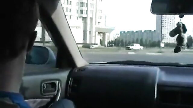 Karina in car driving view with forest nearby, adult tease