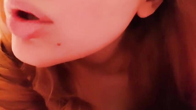 Closeup of sexy redhead ASMR girlfriend's glossy lips and tongue