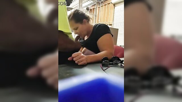 White woman with ponytail sucks black man's cock on lunch break