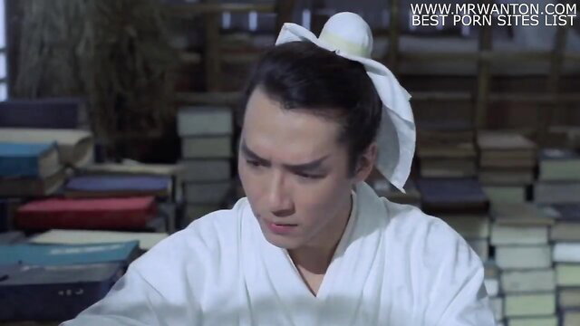Asian man in white robe and headband in erotic scene from Liu Jai Yim Taam