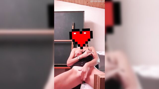 Nude woman masturbating in classroom, legs spread wide