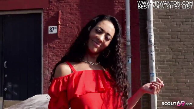 Slim long labia MILF Morgan in red off-shoulder dress street casting