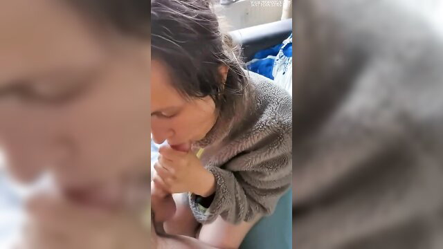 Closeup brunette amateur woman in robe giving sloppy blowjob