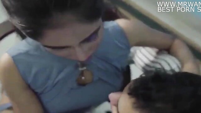 Indian teacher in blue dress leans over student in hot tuition sex preview