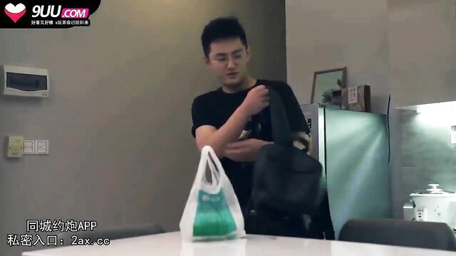 Asian man holding black bag in JAV affair scene