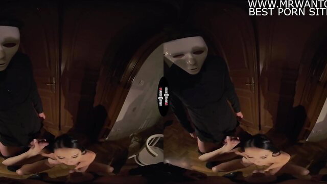 Asian masked woman in black dress dominates, spanks girl on floor VR