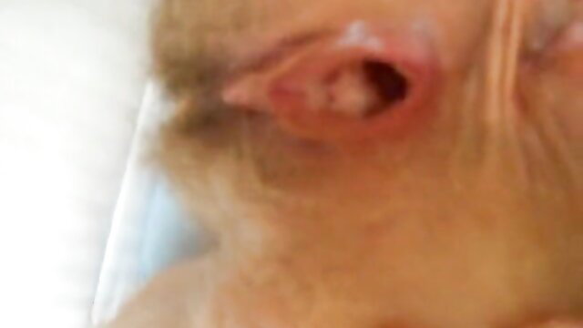 Closeup of woman's gaping spread asshole and ear in extreme anal preview