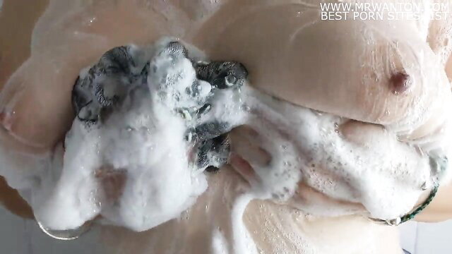 British chubby wife soaping her huge wet tits in shower