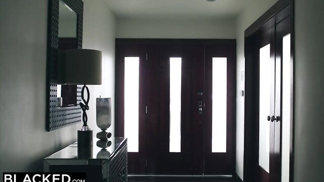 Jesse Jane in dark Blacked entryway, hot blonde poses by door