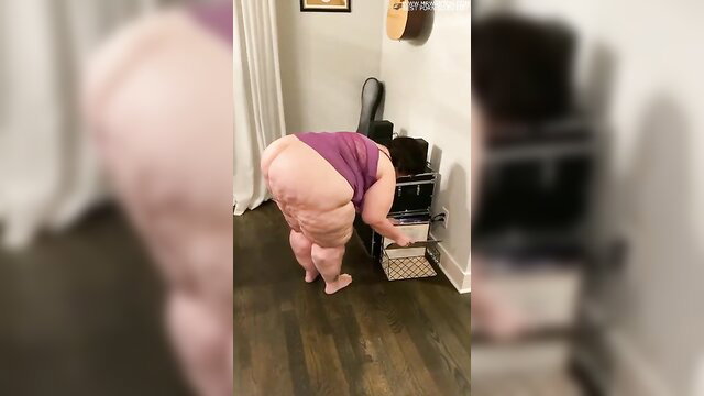 Mature SSBBW bending over in tight purple top, massive booty tease