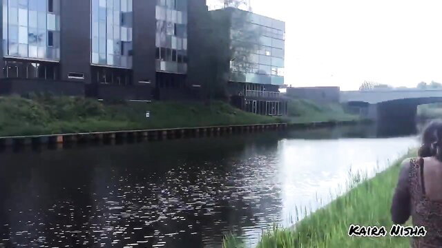 Kaira Nisha by canal in dress, tattooed Indian model street pickup