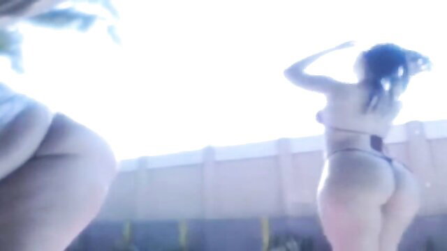 Two busty Latinas in thong bikinis twerking huge asses poolside