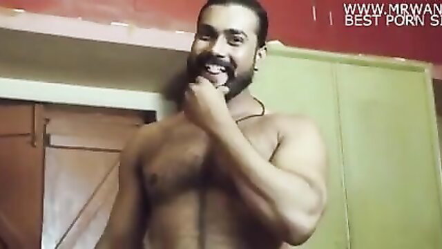Muscular bearded Indian man licking fingers in solo tease