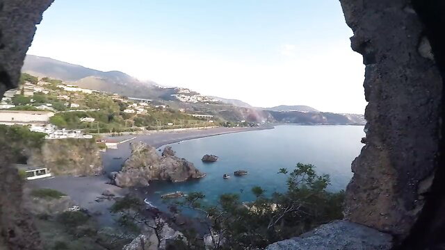 Stunning Amalfi Coast sea view framed in stone window, vacation paradise