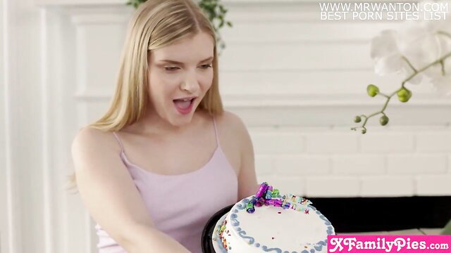 Harlow West in tank top holding cake, teen stepsister vibe