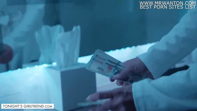 Reagan Foxx in white lab coat holding cash in sexy roleplay